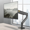 Adjustable black monitor arm supporting a Dell screen on a modern office desk