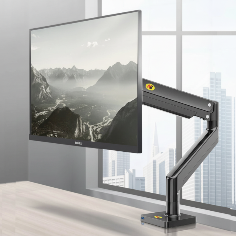 Monitor on a adjustable arm in a modern office setting with large windows.