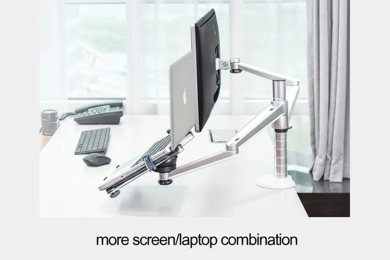 Desk setup with a monitor and keyboard on a white surface, with text 'more screen/laptop combination'.