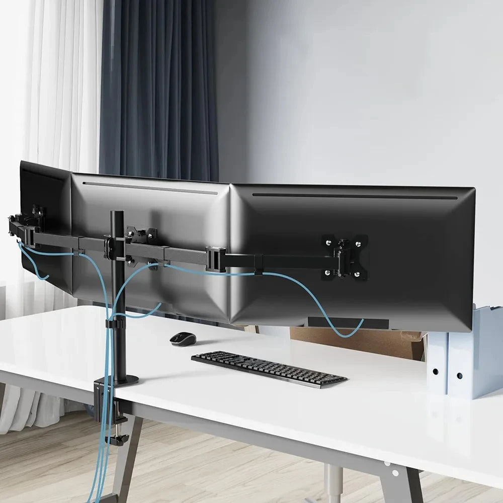 Dual monitor setup on a white desk with a modern office background